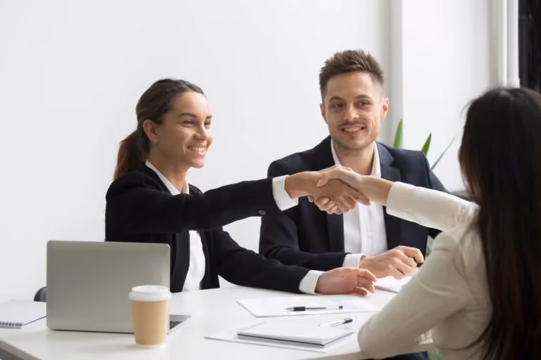 hr representatives positively greeting female job candidate min